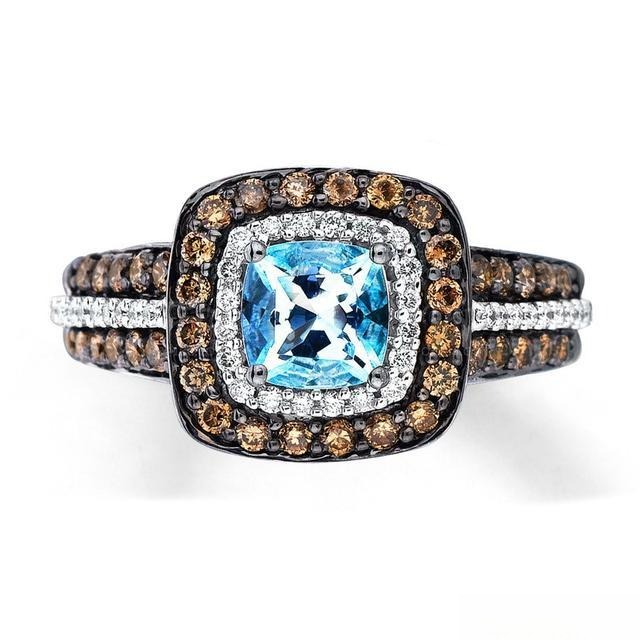 Blue topaz gemstone ring accented with sparkling diamonds, showcasing elegant jewelry design