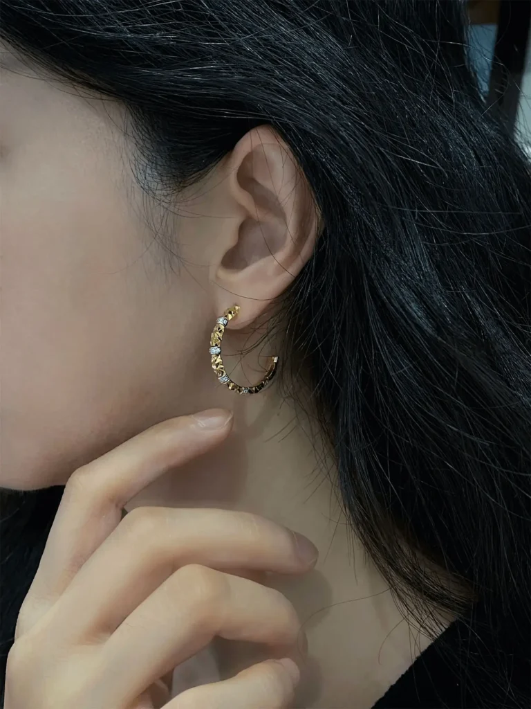 C shape earrings are shown being worn to highlight their fit and style.