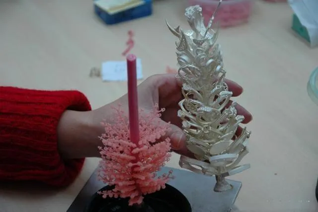A jewelry cast "tree" being cleaned after the casting process to remove any remaining plaster.