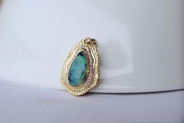 Gemstone pendant with caviar finish metal texture, highlighting unique and detailed craftsmanship