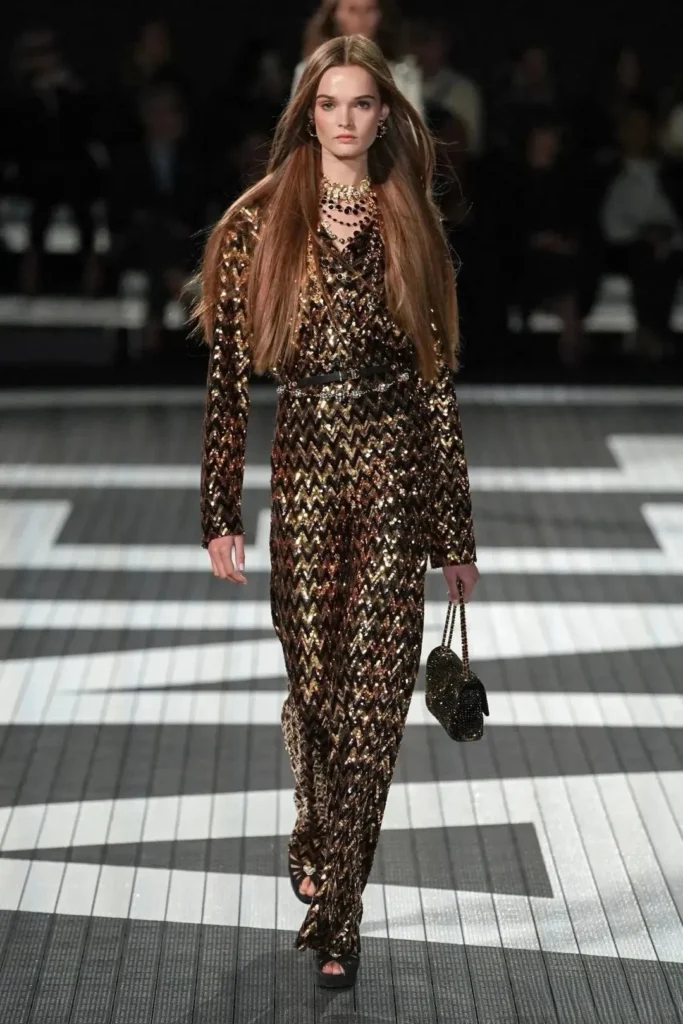  An illustration of a classic Chanel outfit featuring a distinct herringbone pattern, showcasing the brand's elegant and timeless design.