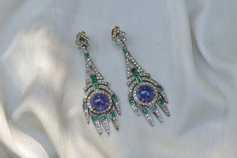 Close-up of sapphire earrings with vivid Royal Blue color, symbolizing timeless luxury