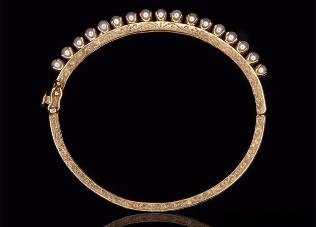 Metal bracelet with intricate chasing engraving, highlighting Jewelry Metal Texturing Techniques