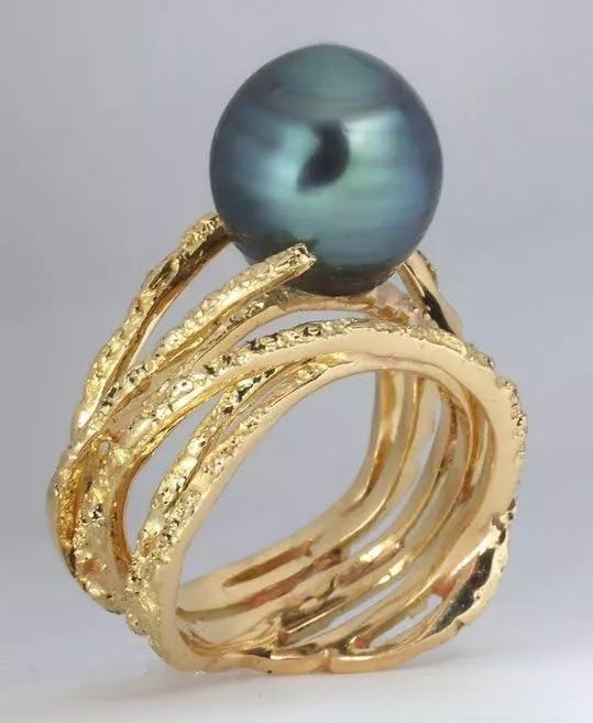 Gemstone ring with crinkled foil-like texture, reminiscent of Ferrero chocolate wrapper