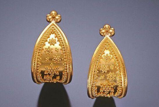 Gold earrings decorated with granulation, showing delicate Jewelry Metal Texturing Techniques
