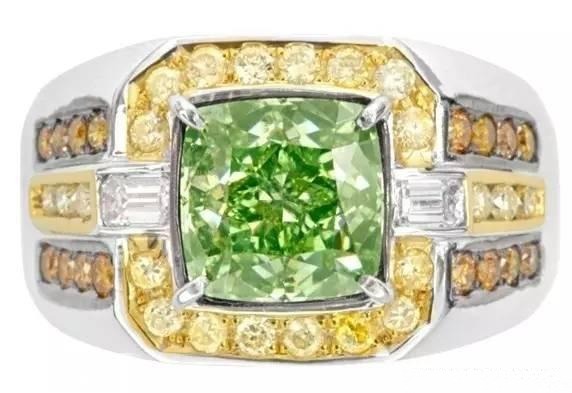 Green diamond ring paired with yellow accent diamonds, showing how backsetting and complementary color techniques enhance the main stone's color and visual impact.