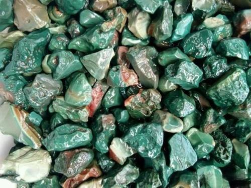 Green Jasper, also called Green Gan Stone, showing dark to light green colors with banded patterns suitable for carving.