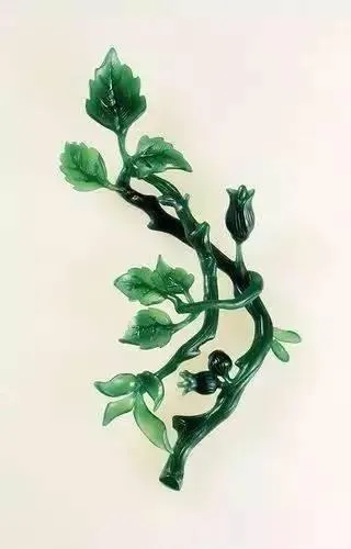 A finely detailed, finished wax model for a jewelry piece, meticulously hand-carved and ready for the casting process.