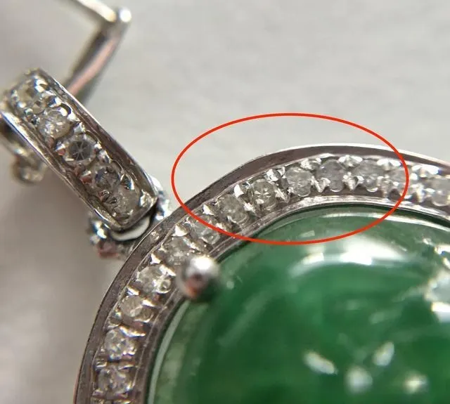 A close-up of a high-quality, finished piece of jewelry with a brilliant, polished metal surface and a smooth finish, showcasing excellent craftsmanship and a secure gemstone setting.