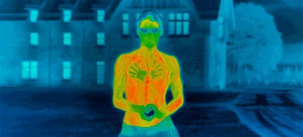 Human body displayed on an infrared thermal imaging device showing heat distribution.