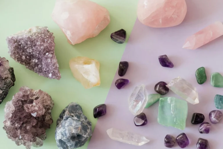 Variety of crystals and gemstones including amethyst and rose quartz, illustrating the differences between jasper and nephrite jade.