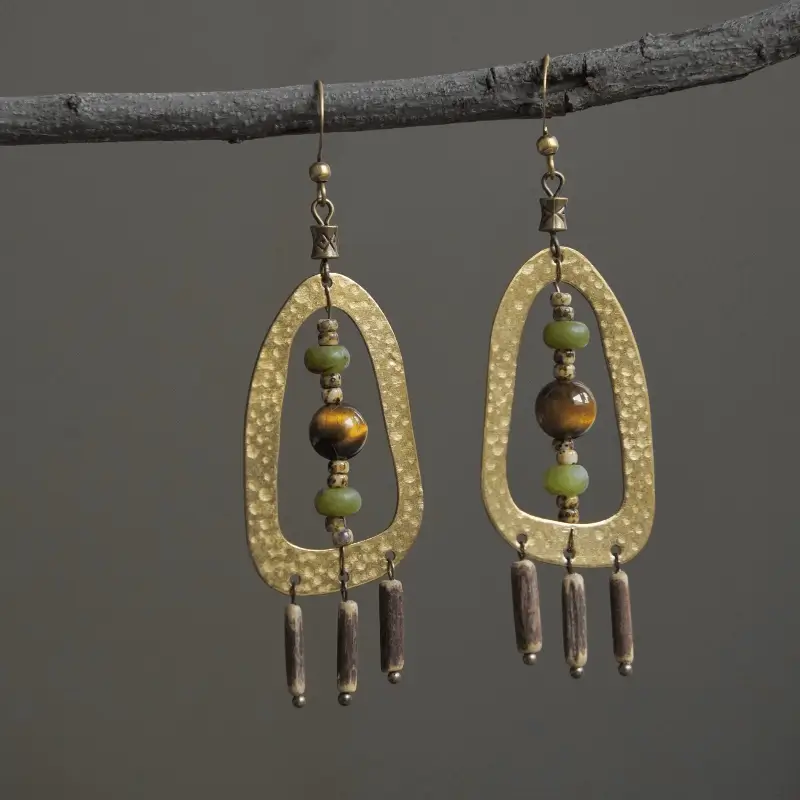 Handmade hammered brass earrings by Jewea, featuring tiger eye stones with unique textured finish