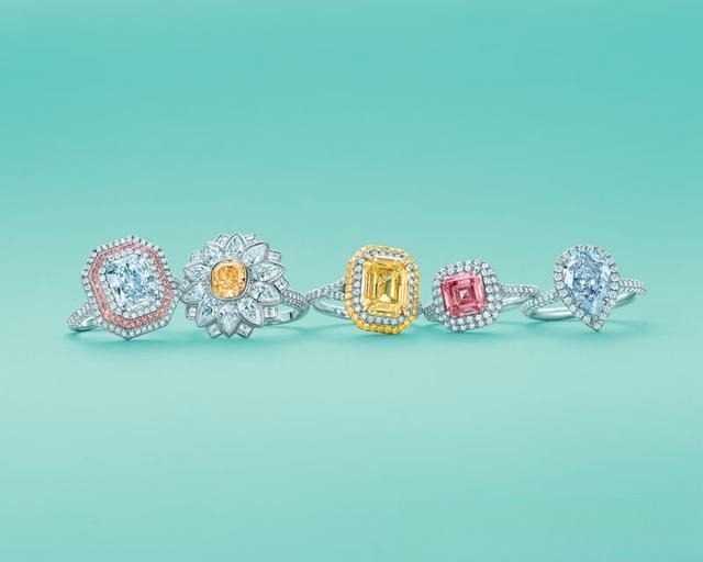 Light yellow diamond ring using a gold or K-gold backsetting technique, enhancing the diamond's color by at least two grades.