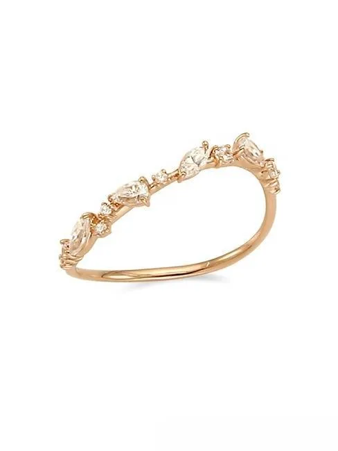 Minimalist asymmetrical gold ring with a marquise-shaped diamond, featuring a modern and distinctive band design.