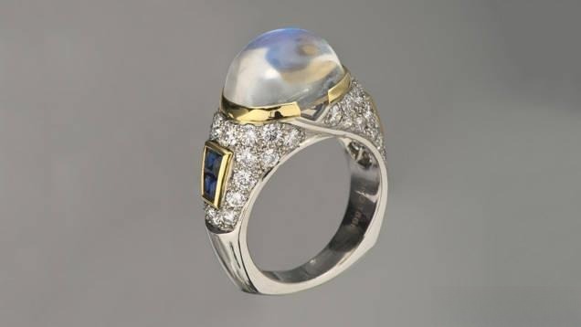 Moonstone ring featuring a beautiful blue adularescence, showcasing its natural shimmer and elegance.