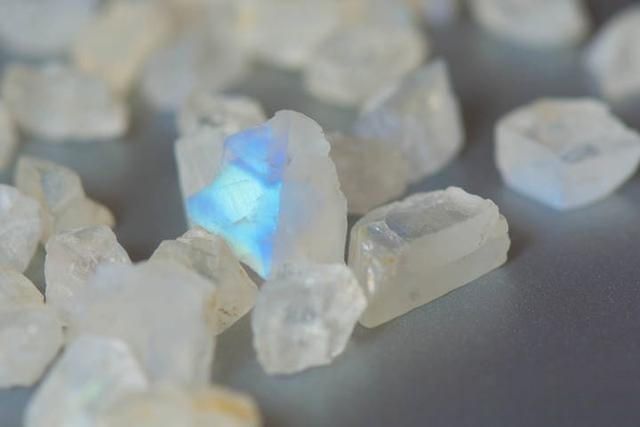 Moonstone rough specimen displaying blue and sometimes yellow adularescence; minor inclusions add unique character without reducing value.