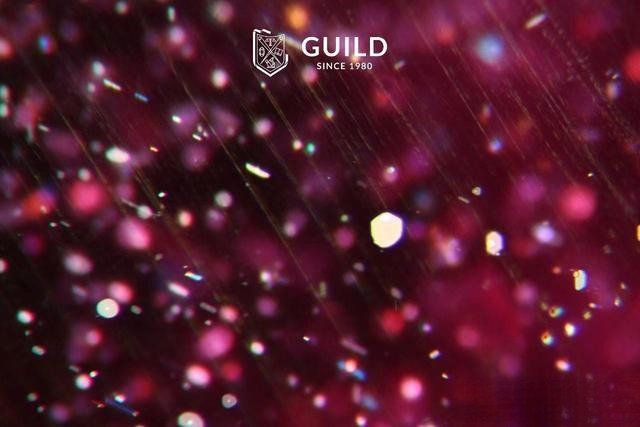 Plate-like inclusions observed in a Mozambique ruby under magnification.