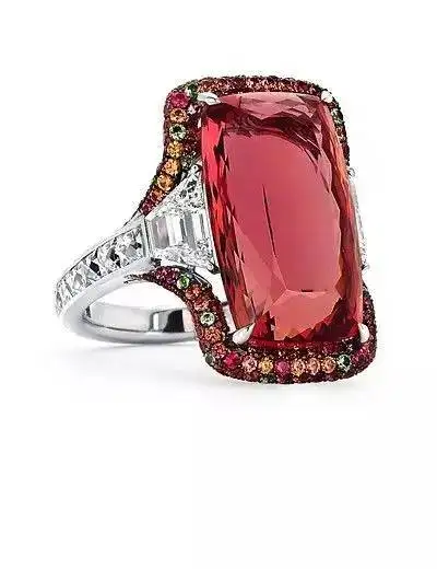 An elegant ring featuring a peach topaz center stone with a halo of sparkling diamonds.