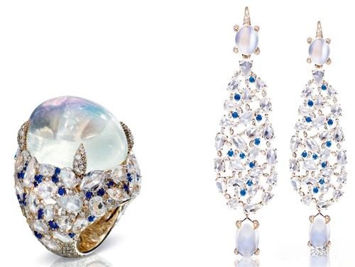 Pomellato Pom Pom collection featuring a moonstone ring and iridescent earrings with shimmering adularescence.