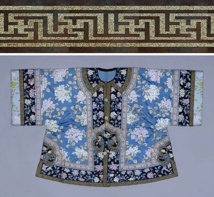 An image of a Qing Dynasty garment. The clothing features a background of interlocking swastika and curved water patterns. The main design is a "Five Blessings Holding Longevity" motif, with five bats surrounding a central character for longevity. The intricate patterns symbolize continuous good fortune and everlasting blessings.