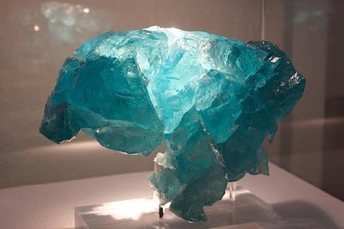 Irregular raw aquamarine gemstone in natural unpolished state with unique shape