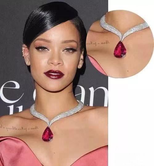 Rihanna wearing a glamorous ruby necklace, showcasing vibrant red gemstones on the red carpet