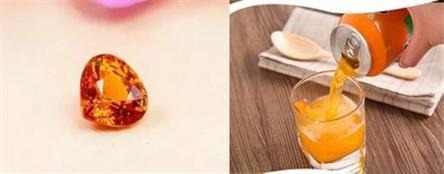 Spessartine garnet gemstone displayed next to a real Fanta orange showing similar bright orange color