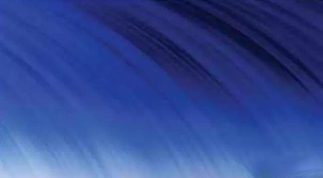 Microscope image of curved growth lines and gas bubbles inside a synthetic sapphires