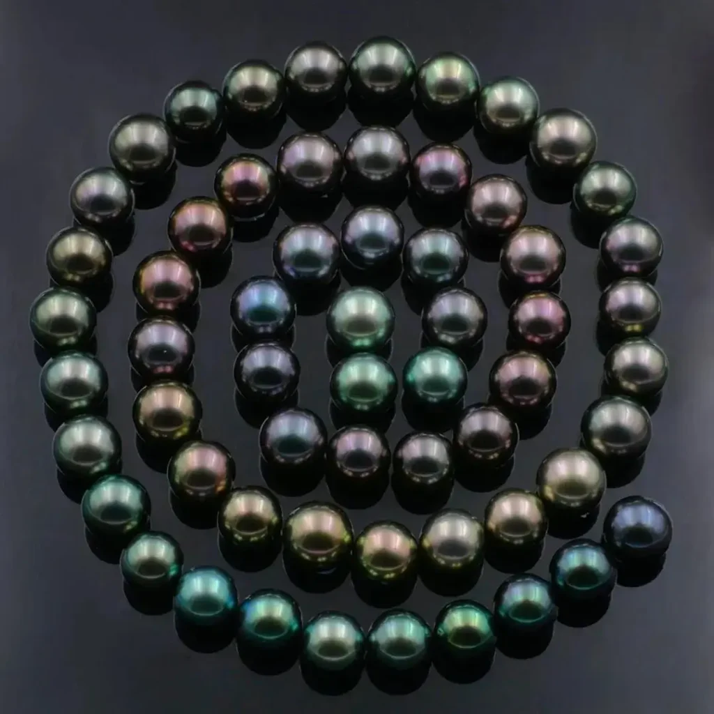 Tahitian Black Pearls showing a mysterious black base with colorful rainbow overtones