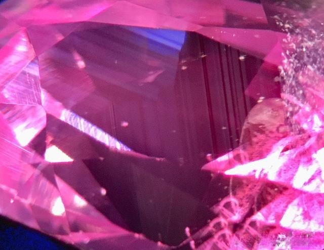 Unheated Vietnam Pink Sapphires under light, showing a subtle bluish undertone typical of natural stones.