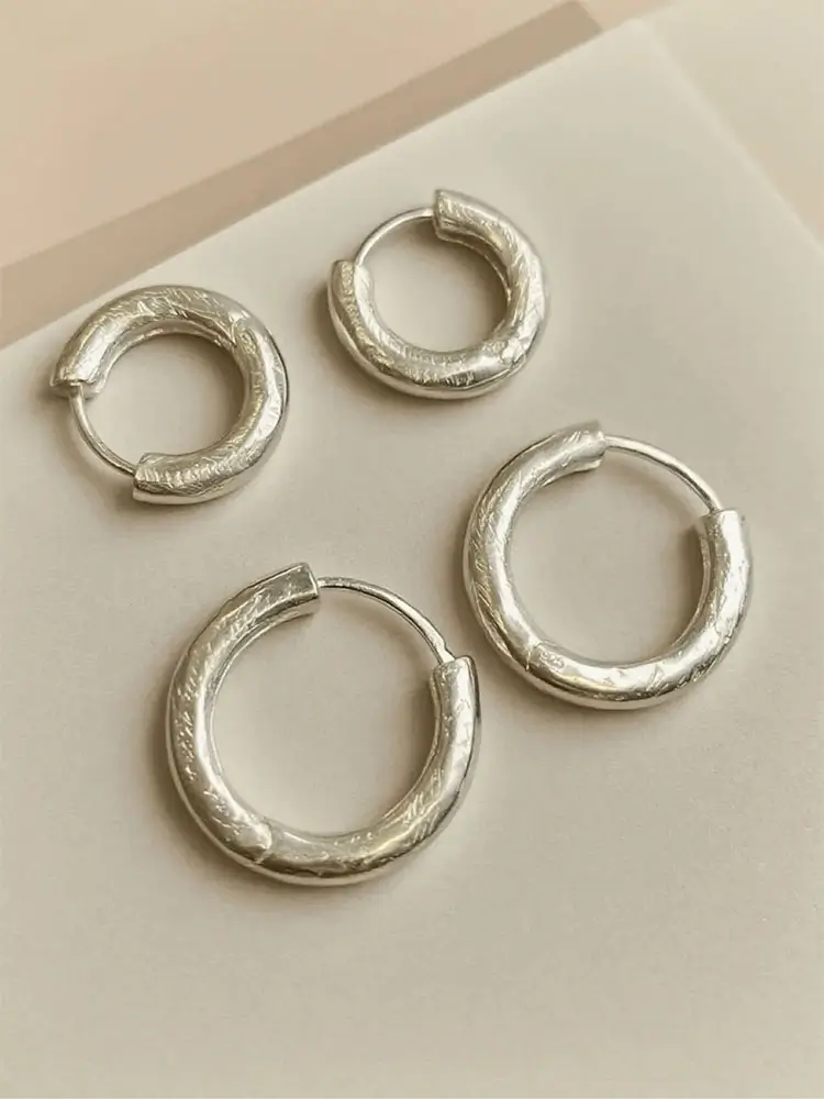 Unisex silver hoop earrings with natural, unplated finish, perfect for minimalist everyday style.