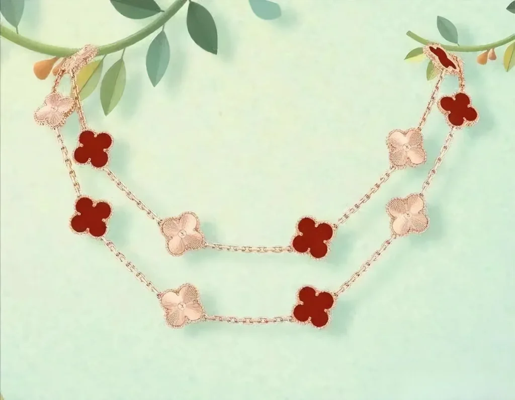 An illustration of a Van Cleef & Arpels Alhambra necklace. The necklace is made of a gold or platinum chain and features the brand's iconic four-leaf clover pendants, each crafted from materials such as onyx, malachite, mother-of-pearl, or other gemstones, creating an elegant and highly recognizable design.