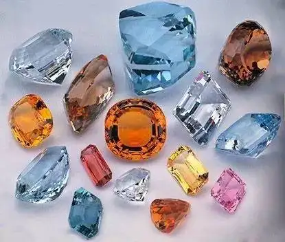 A collection of topaz images in various colors, highlighting Topaz colors and value from golden yellow and orange to blue and pink.