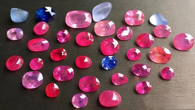 Vietnam Pink Sapphires, mostly under 1 carat, with visible inclusions and imperfect cuts that highlight their raw, unfiltered charm.