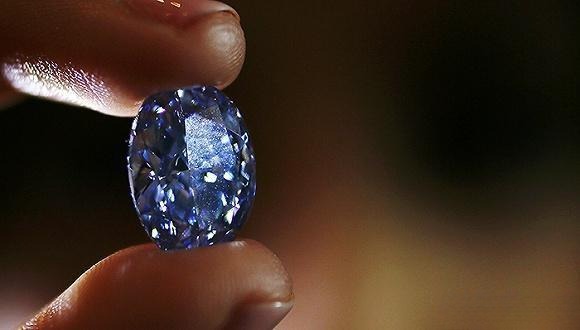 Close-up of a 14.6-carat rare blue diamond valued between 35 and 45 million USD, showcasing exceptional color and brilliance.