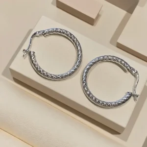 Handmade 925 sterling silver hoops with a classic twisted design, perfect for daily wear.
