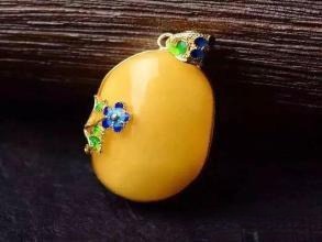 Amber-set jewelry featuring cabochon or carved amber mounted to conceal minor surface flaws – Gemstone Jewelry Buying Tips.