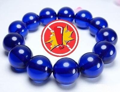 Blue amber bracelet displaying a deep, vivid blue color, highlighting gemstone beauty – Gemstone Jewelry Buying Tips.
