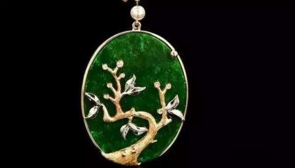 Cabochon jade pendant mounted to conceal minor surface flaws, making stone appear flawless while underlying quality remains.