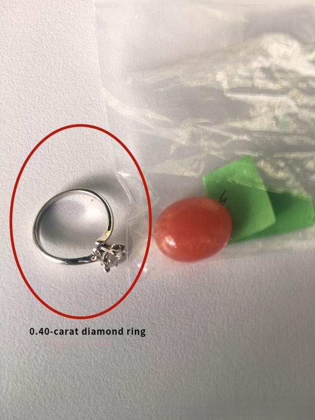 0.40-carat diamond ring before jewelry redesign, plain setting masking the stone's brilliance.