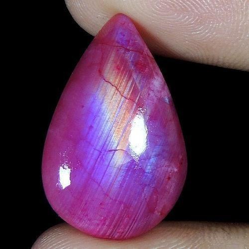Dyed pink moonstone showing artificially enhanced bright pink color。