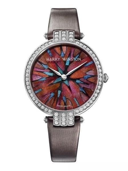 Luxury watch featuring feather marquetry on the dial, showcasing intricate craftsmanship in watchmaking