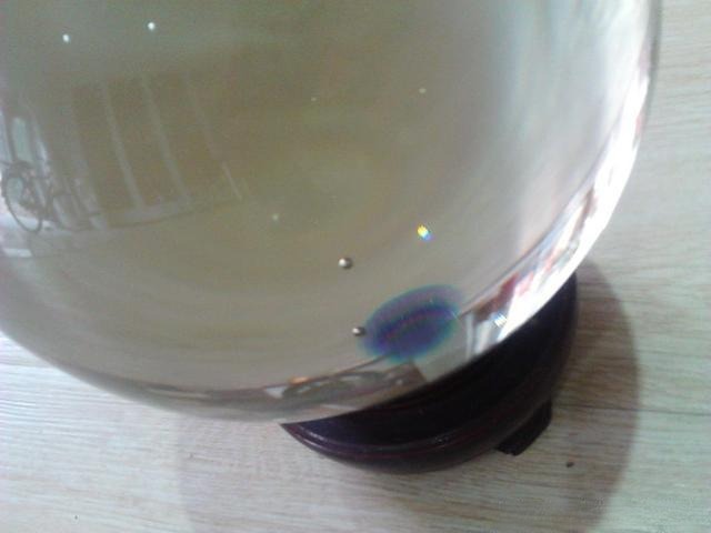 Close-up of bubbles in glass, often used to distinguish glass from natural quartz crystals