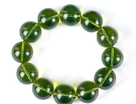 Imitation green amber bracelet, featuring beads that mimic natural green amber, commonly made from treated copal or resin.