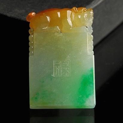 Carved jade plaque with intricate details and smooth texture, a beautiful piece of natural jade artwork.