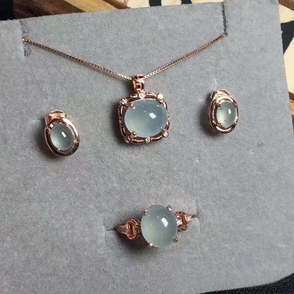Handcrafted jade jewelry set featuring necklace, stud earrings, and ring, highlighting natural A-jade beauty, translucency, and artisan design.