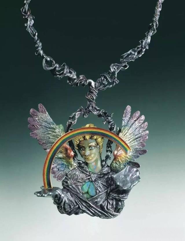 Kevin Coates Bestiary necklace featuring a gold-haired figure with wings and rainbow elements, showcasing mythical and symbolic design