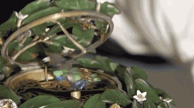 Internal view of Fabergé laurel tree egg revealing a miniature mechanical bird that sings when a gemstone switch is activated, then retreats back into the leaves