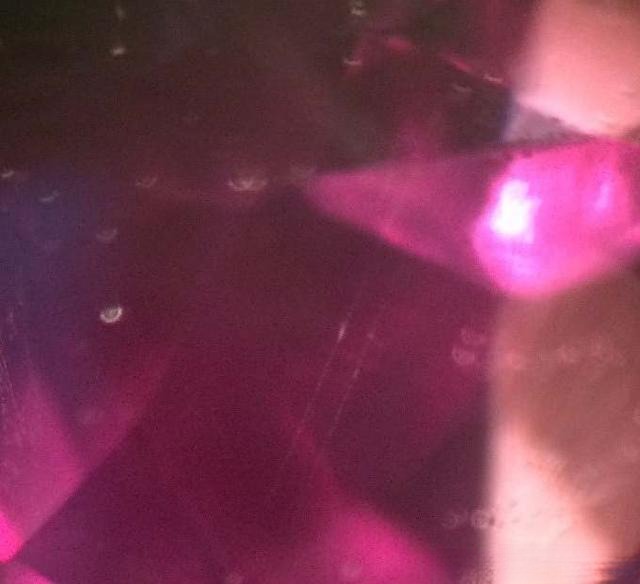 Madagascar pink sapphire showing heat treatment signs: rutile needles appear fuzzy, broken, dry, and lack luster