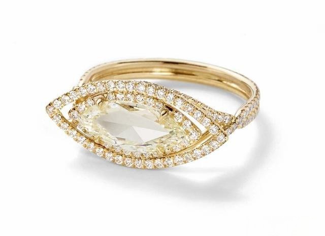 A ring featuring a marquise-shaped diamond, showcasing its elegant and elongated form, adding a touch of sophistication to the design.